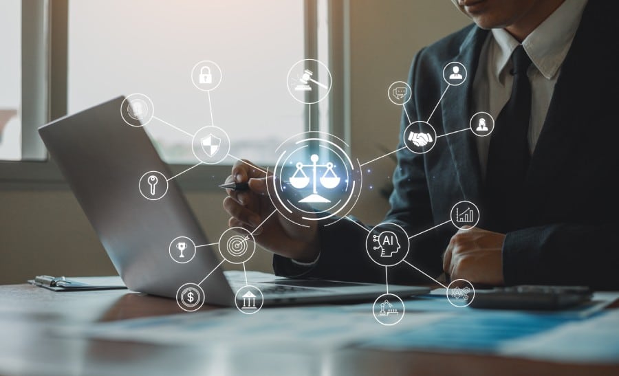 Business professional using a laptop with digital icons representing legal services, cybersecurity, and AI, symbolizing managed IT solutions for law firms.