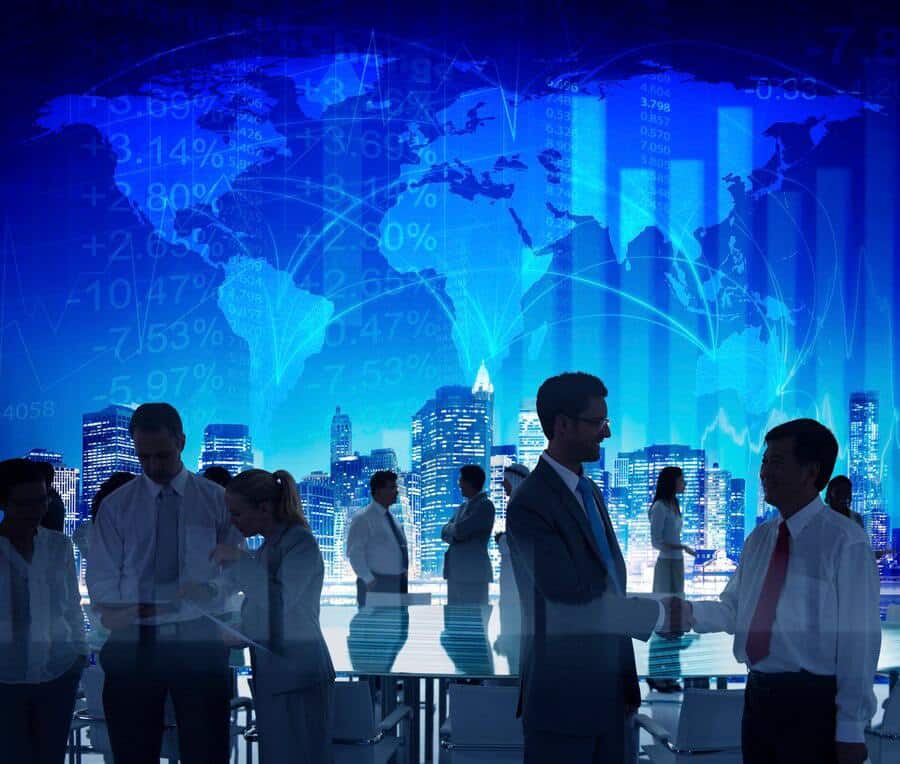 Business professionals engaging in discussion and handshake against a backdrop of a city skyline and digital data visualization, representing collaboration and strategy in IT services.